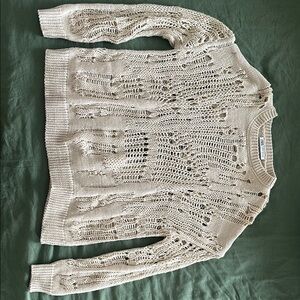 Cream Crew Neck Sweater with Distressed Knit Pattern and Long Sleeves